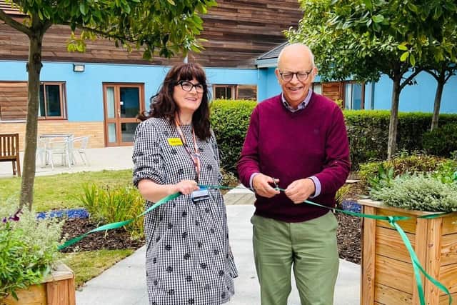 Berrywood chaplains Odette Douglas and Daniel Tabor Chair of the NIFF cut the ribbon.