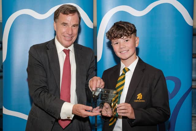 Josh (right) accepting his award from Christian Brodie at the Best in Everyone Awards