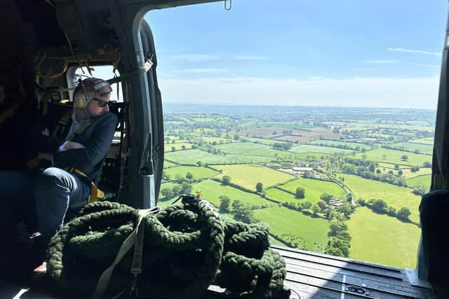Mike Reader MP overseeing the Somerset countryside in a Merlin helicopter