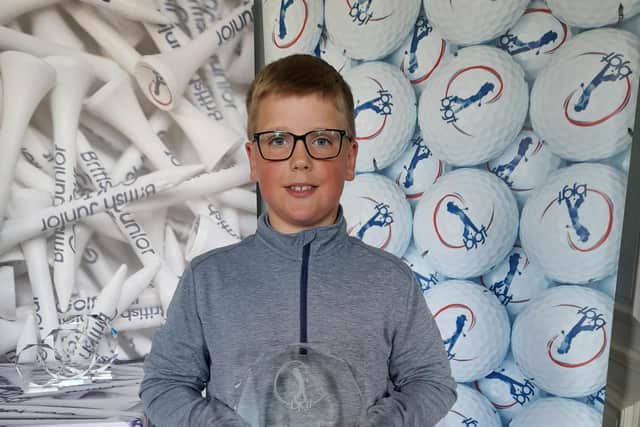Oliver Golby, aged nine, with his British Junior Golf Tour trophy.
