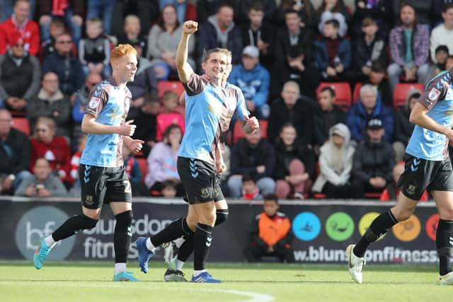 Ben Fox celebrates his first Cobblers goal.