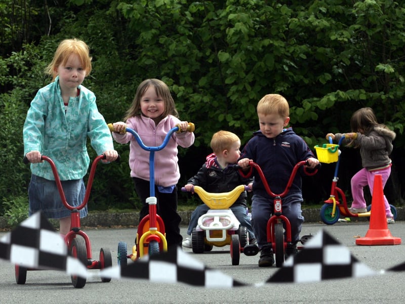 Children from Little Acorns Day Nursery taking part in a peddle push for the NSPCC - pictured at the ASDA depot where the nursery is.
