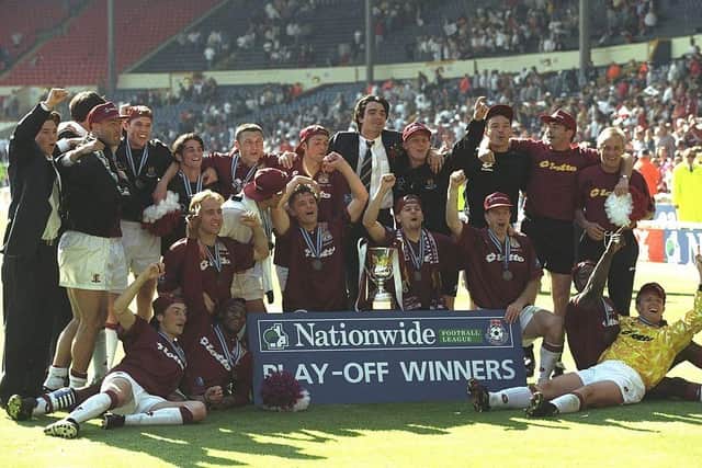 The Cobblers players celebrate their victory against Swansea City in the Nationwide Division Three Play Off Final at Wembley Stadium on May 24, 1997