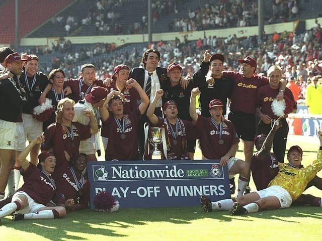The Cobblers players celebrate their victory against Swansea City in the Nationwide Division Three Play Off Final at Wembley Stadium on May 24, 1997