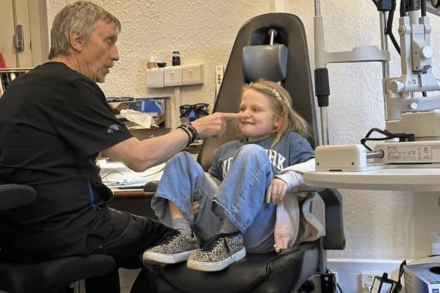 Brian Tompkins with a young TK&amp;S patient