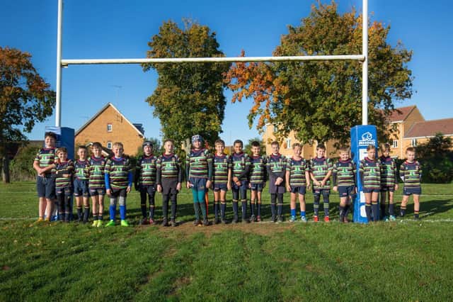 Acorn Analytical Services has sponsored kits for the Northampton Old Scouts Under 7s and Under 11 teams, pictured.