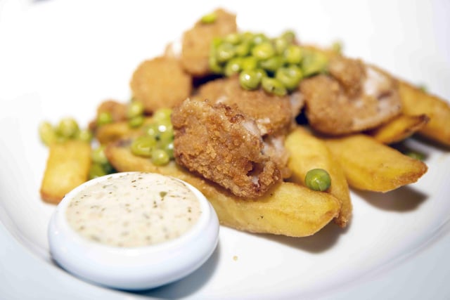 Homemade scampi with refried chips, crushed garden peas and tartare sauce.