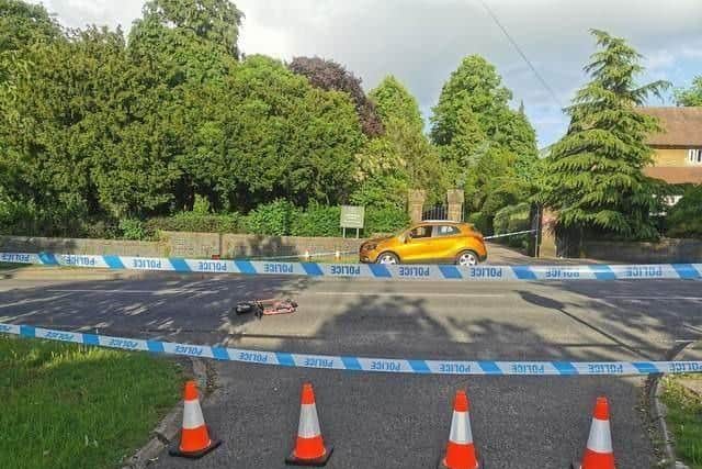 The scene outside Towcester Road Cemetery after the woman in her 20s was knocked off of her Voi scooter on Friday (June 10)