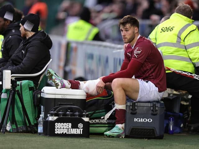 Sam Sherring sits with an ice pack on his calf after coming off on Saturday