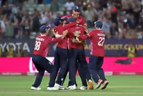 Ben Sanderson is mobbed after claiming the match-winning wicket (Picture: Peter Short)