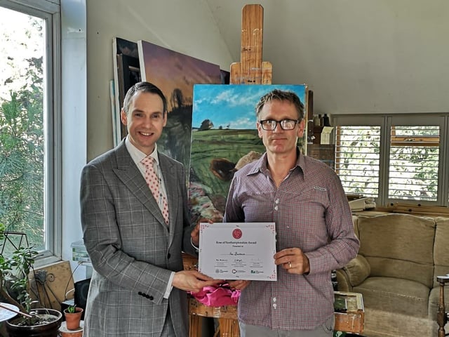 Councillor Dan Lister from West Northants Council presenting Lee Burrows, Founding Member of The Wild Bunch, with a Rose of Northamptonshire Award. Lee Burrows works to protect and improve the local environment. As a Founding Member of The Wild Bunch, a wildlife and conservation working group, Lee works with a variety of local organisations to educate participants about the importance of protecting local wildlife.