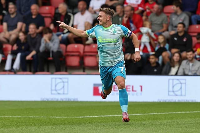 Sam Hoskins gestures towards Tyrese Fornah after the two combined superbly to score the winning goal against Orient.