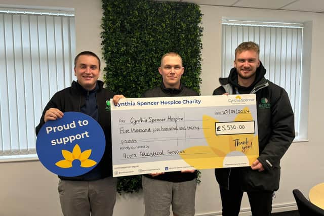 Alex, Dan and Max presented the cheque to Cynthia Spencer Hospice