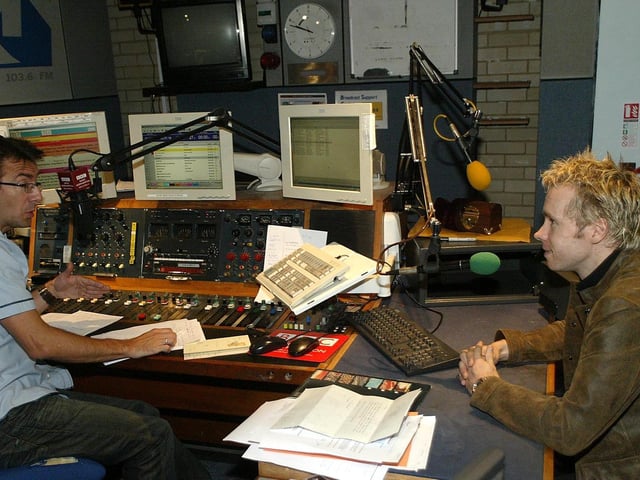 BBC Radio Northampton presenter Bernie Keith with magician David Penn, locking up a box with a Chronicle headline prediction inside. September 5, 2006