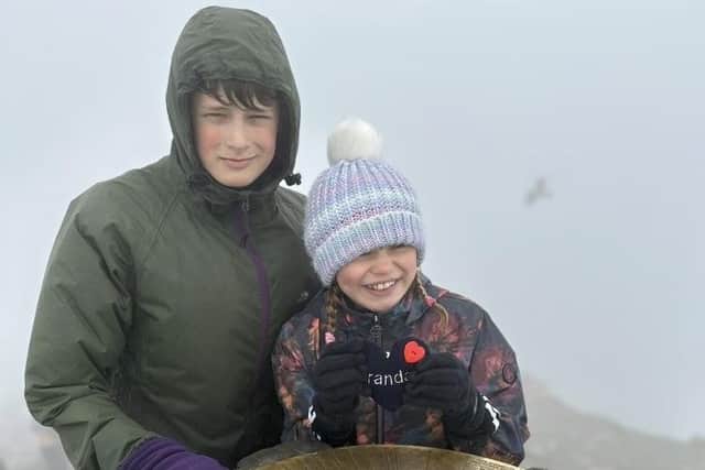 Callum and Imogen were gifted a love heart made from their grandad’s clothing, which they carried with them all the way to the summit.