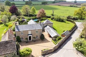 This traditional home has a modern twist, a huge swimming pool and rolling countryside views.