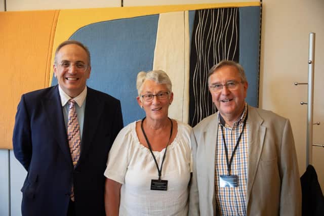 Sir Michael Ellis MP with Sally Romain, chair of the Northants Litter Wombles, and Gordon Shone from the NLW Committee.