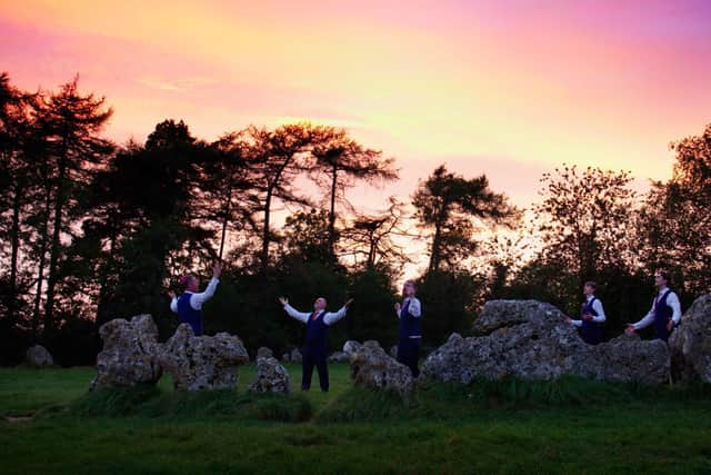 Mosaic Voices choir performing at the Rollright Stones in Oxfordshire as part of Psalms
