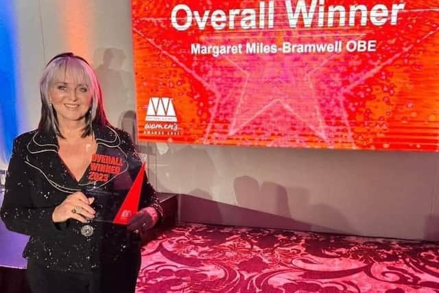 Margaret Whittaker collecting her award for Business Woman of the Year 2023
