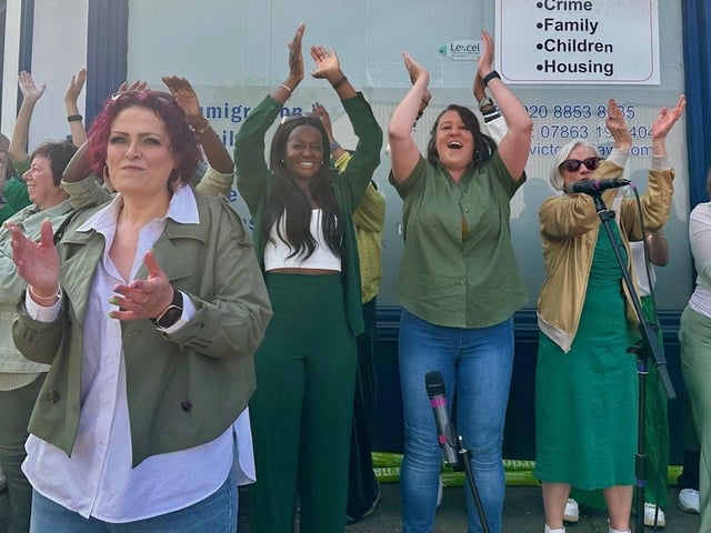 Northants Sings Out perform for runners at the Barnardo's cheer station at the London Marathon