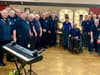Nonagenarian takes to stage with massive choir