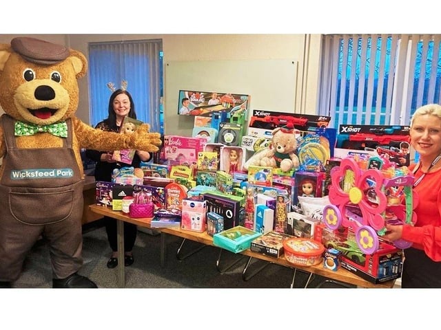 Wicksteed Park staff and Wicky Bear with donations