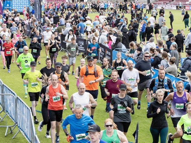 Hundreds of runners braved showers and wind to take on the race on Sunday (May 25), which started and finished at Sixfields stadium.