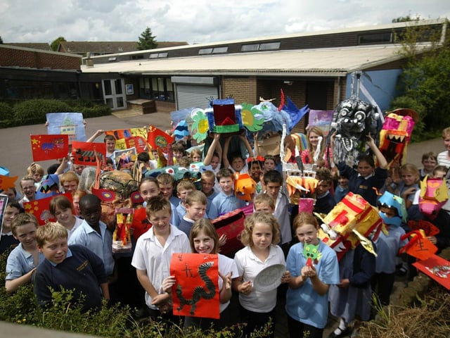 Brixworth Primary School having a Chinese arts week. Dragon costumes and Chinese art work.