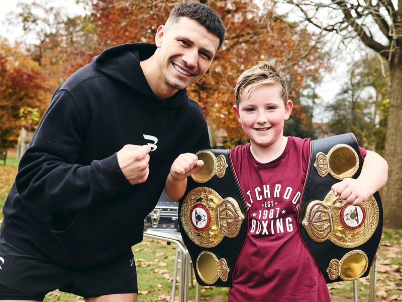 Kieron Conway poses for a picture with an impressed young fan
