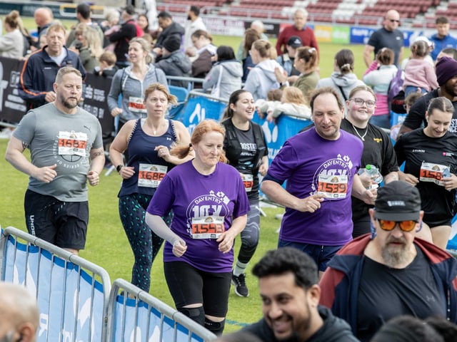 Hundreds of runners braved showers and wind to take on the race on Sunday (May 25), which started and finished at Sixfields stadium.