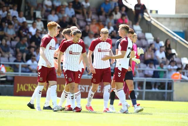 Mitch Pinnock gets the plaudits after opening the scoring against Luton Town. Pictures: Pete Norton.