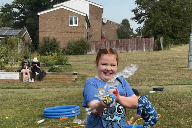 A member of the community enjoying the Water fun Day hosted by charity Growing Together Northampton