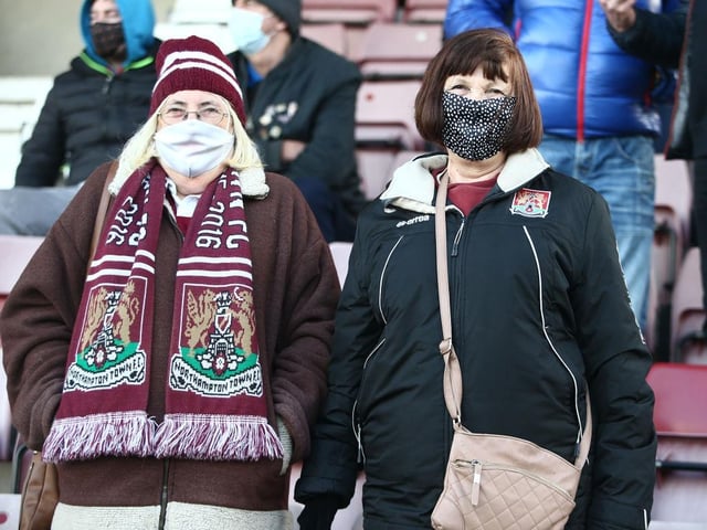 Northampton Town fans return to watch their team during the Sky Bet League One match between Northampton Town and Lincoln City at PTS Academy Stadium on December 19, 2020.
