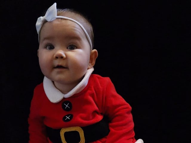 Seven-month-old Willow Wrenn in a very cute Santa outfit.