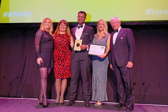 Ben and Nicola Francoise, from Saints Coffee, picking up their Community Cafe of the Year gold award.