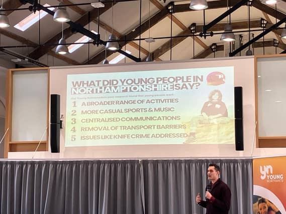 A picture of a screen with a speaker and Young Northants logo on a banner.