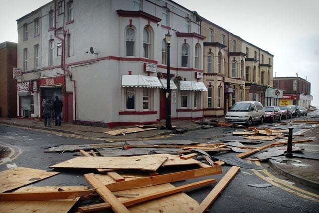 Sections of roof litter Bairstow Street in Blackpool, including badly damaged cars, 2007
