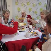 Residents at St. Christopher's Care Home enjoy their Coronation Day Afternoon Tea