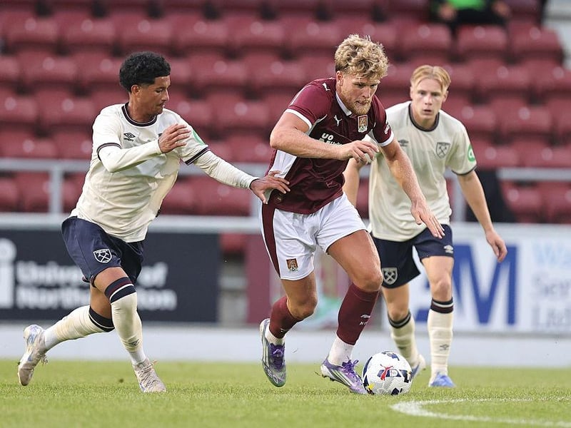 Cameron McGeehan, who nearly got on the end of numerous balls into the box, gets away from Gabriel Caliste
