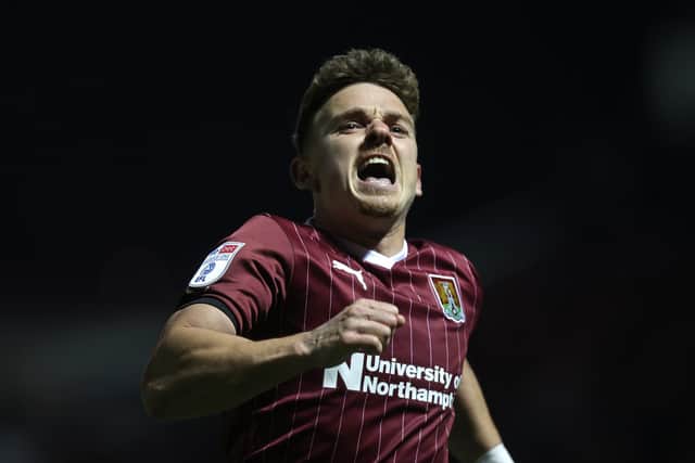 Sam Hoskins celebrates his second goal for the Cobblers against Leyton Orient, a strike that took up to 10th place in the club's all-time scorers' list. Hoskins now has 83 Town goals to his name (Photo by Pete Norton/Getty Images)