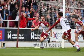 Max Dyche celebrates his first Cobblers goal