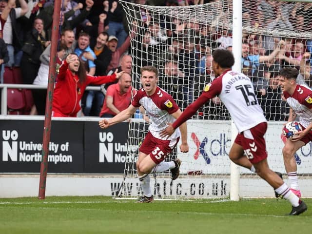 Max Dyche celebrates his first Cobblers goal