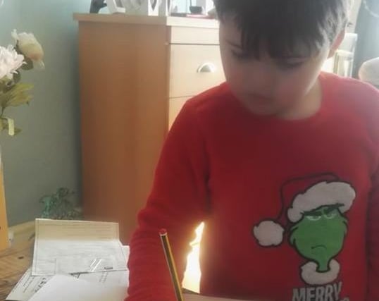 Kieron busy with his homework.