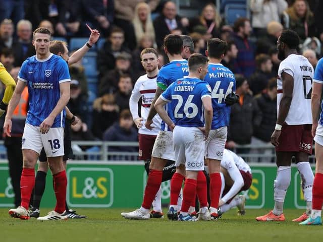 Tom McIntyre is shown a straight red card by referee Sam Purkiss during Saturday's League One game between Portsmouth and Northampton.