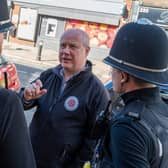 Police, Fire and Crime Commissioner Stephen Mold talking to police officers