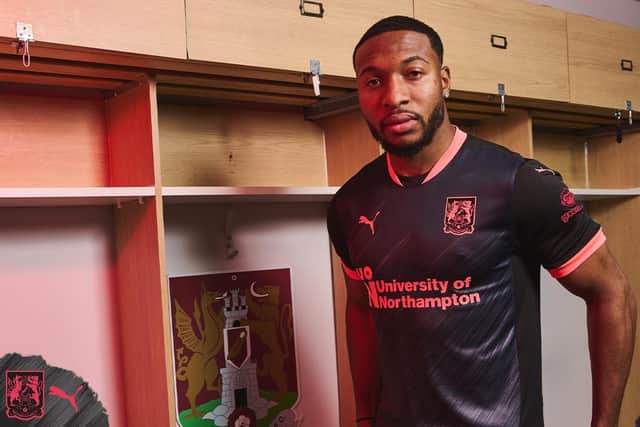 Ali Koiki models the new Cobblers third kit.