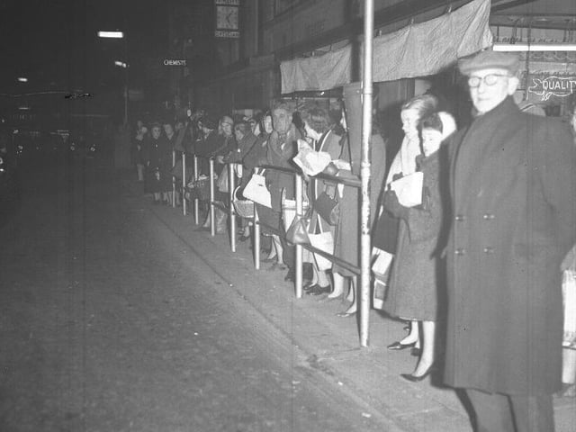 People waiting, perhaps for Christmas lights switch-on