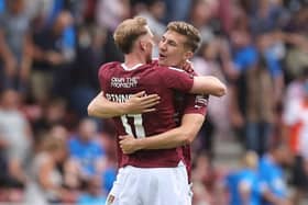 Mitch Pinnock and Harvey Lintott embrace after the full-time whistle as Northampton beat Peterborough. (Photo by Pete Norton/Getty Images)