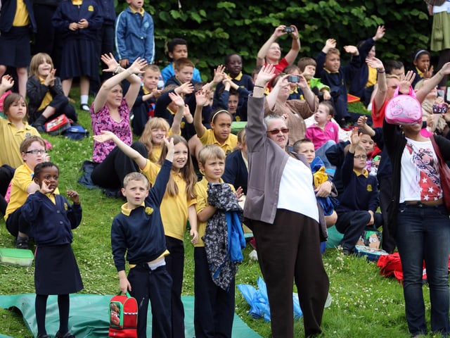 Crowds waving goodbye to Bob at his retirement party