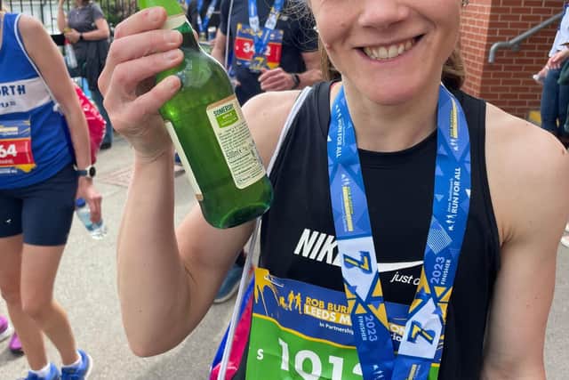 Rachel with a celebratory beer after one of her runs.